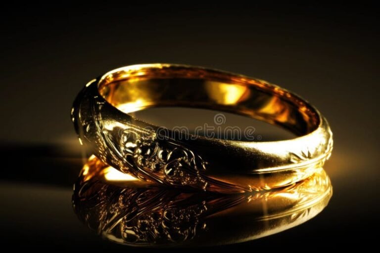 Qué significado tiene el anillo de oro en El Señor de los Anillos 26 anillo dorado brillando en un fondo oscuro